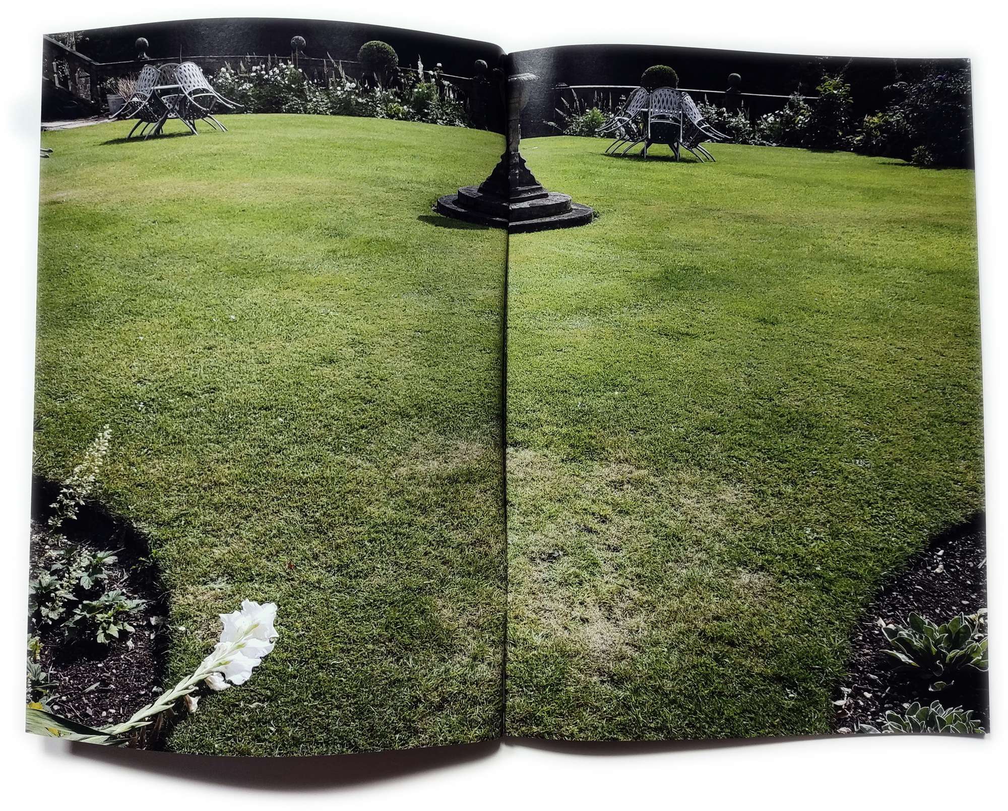 Zine spread of a tidy estate lawn and garden.