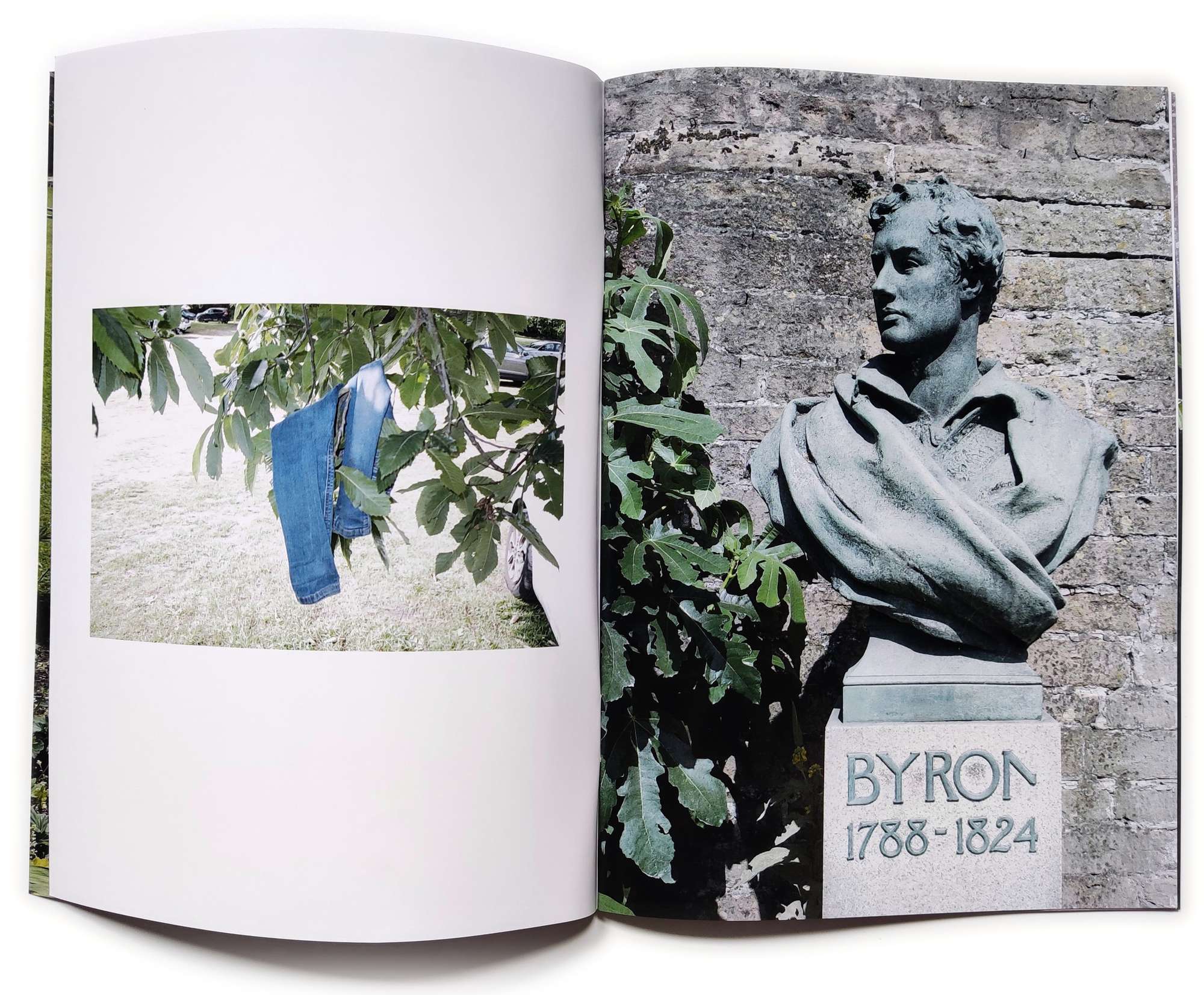 A zine spread of jeans hanging from a tree and a statue of Byron.